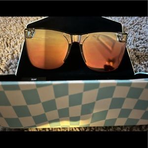 Woman’s Quay sunglasses and case.